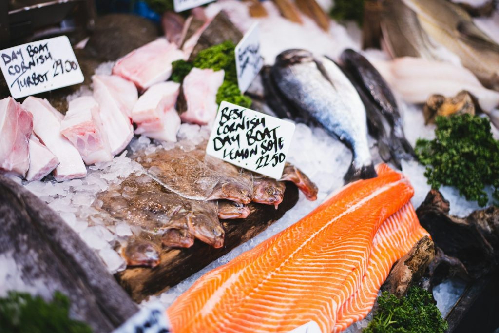 a variety of fish on display at a market